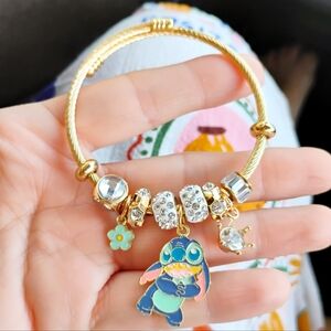 Gold Charm Bracelet with Blue and Gold Accents